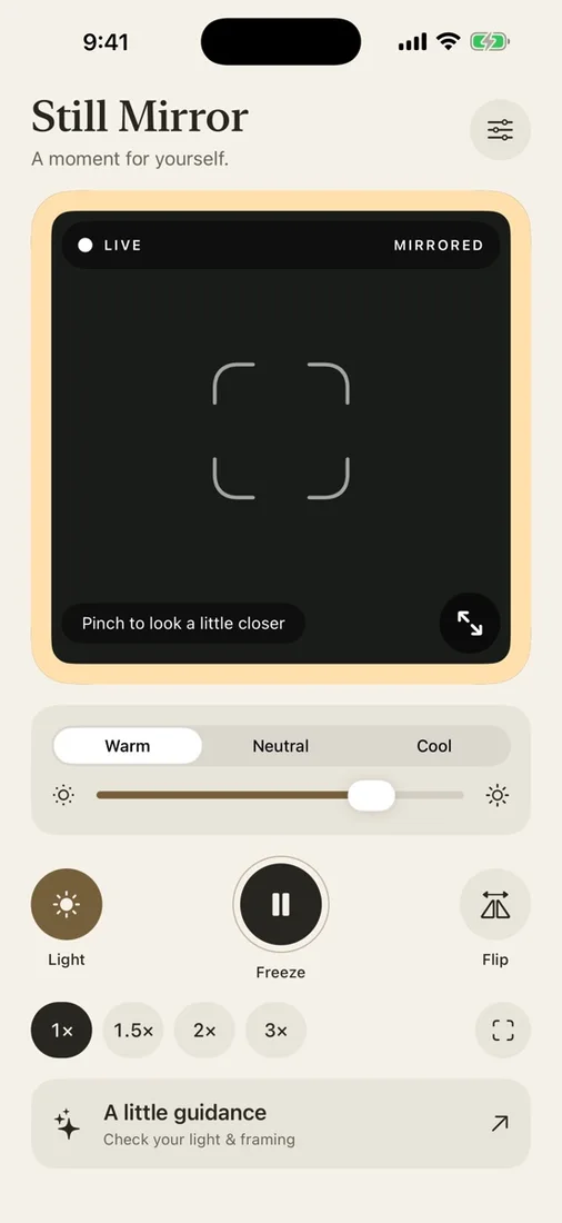Still Mirror with warm screen light, brightness control, and framing guide enabled